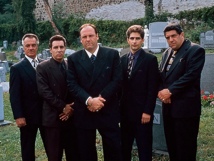 Five characters from HBO's Sopranos standing in a cemetery